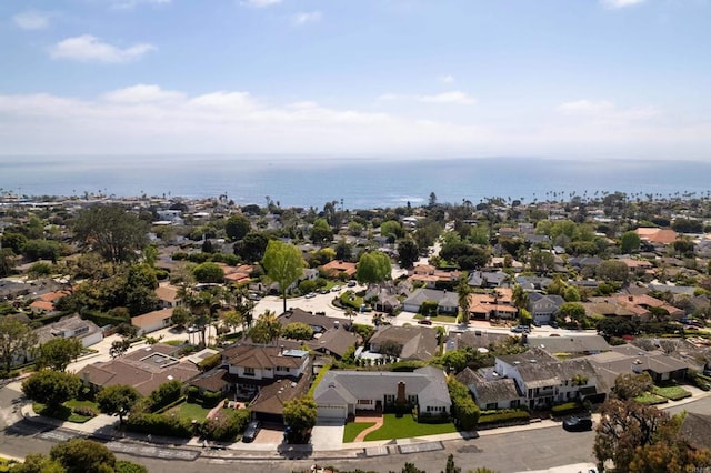 drone / aerial view featuring a residential view and a water view