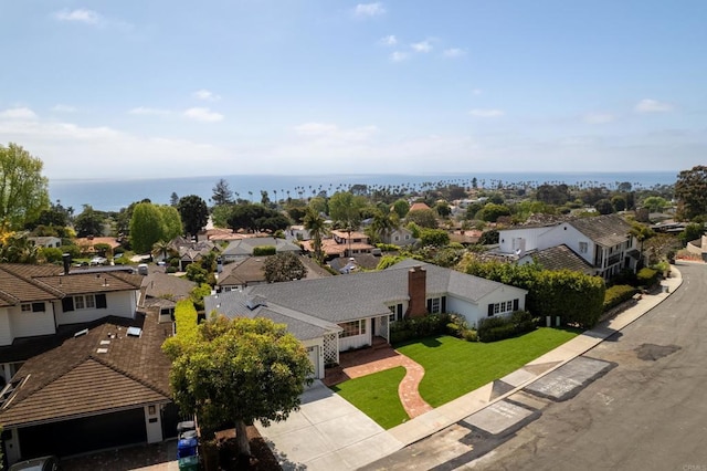 birds eye view of property with a water view and a residential view