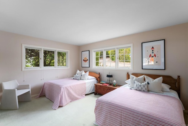 bedroom featuring carpet floors and baseboards