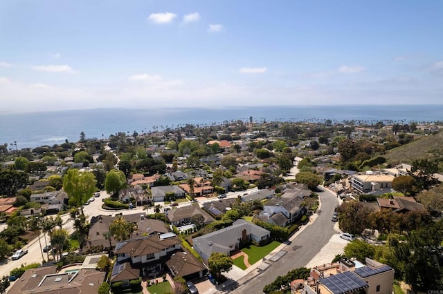 birds eye view of property featuring a water view and a residential view