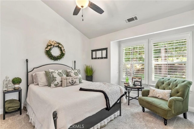 bedroom featuring baseboards, visible vents, light carpet, and lofted ceiling