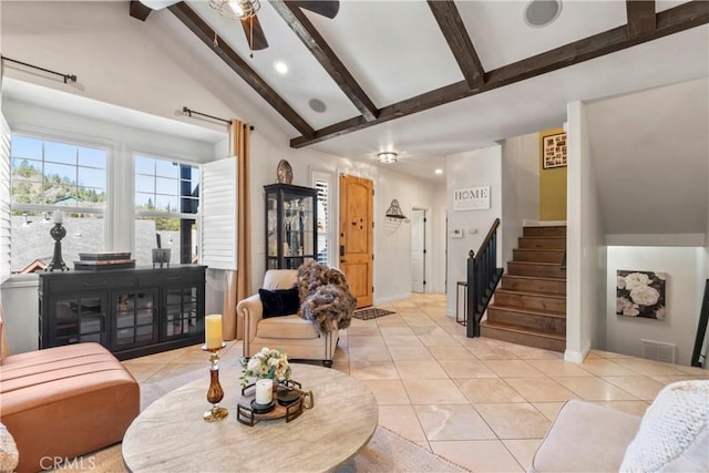 living area with stairway, light tile patterned floors, high vaulted ceiling, and beam ceiling