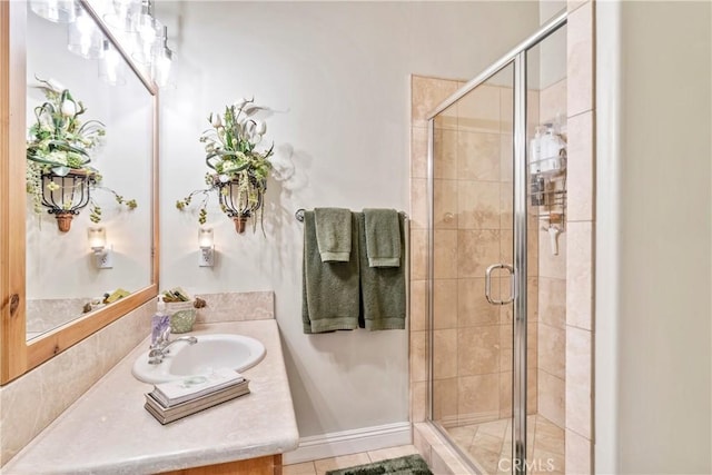 bathroom with vanity and a shower stall