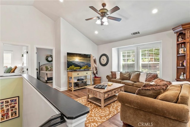 living room with a ceiling fan, visible vents, wood finished floors, and recessed lighting