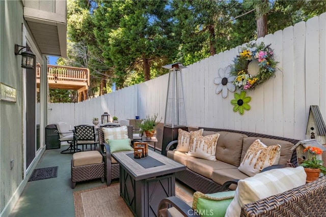 view of patio / terrace featuring an outdoor hangout area and a fenced backyard