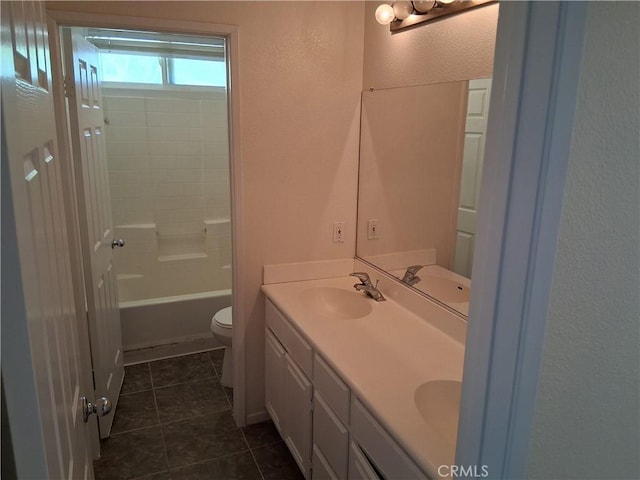 33 Corte Rivera, Lake Elsinore, CA 92532 - bathroom with double vanity, toilet, a textured wall, tile patterned flooring, and bathing tub / shower combination
