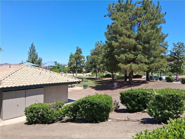 33 Corte Rivera, Lake Elsinore, CA 92532 - view of home's exterior featuring a tile roof and stucco siding