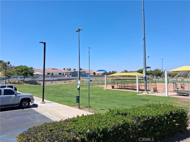 33 Corte Rivera, Lake Elsinore, CA 92532 - surrounding community with a lawn