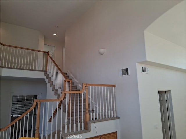 33 Corte Rivera, Lake Elsinore, CA 92532 - staircase with recessed lighting and a high ceiling