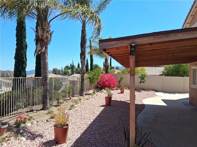 33 Corte Rivera, Lake Elsinore, CA 92532 - fenced backyard featuring a patio area