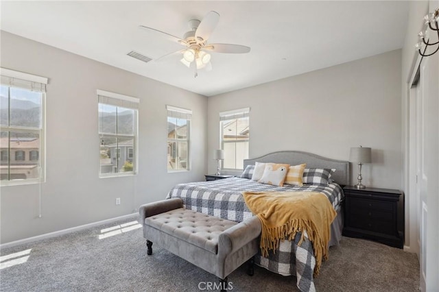 bedroom with carpet flooring, baseboards, and a ceiling fan