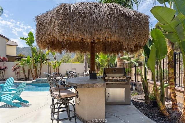 view of patio featuring grilling area, a fenced backyard, and area for grilling