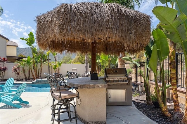 11266 Hutton Rd, Corona, CA 92883 - fenced backyard featuring an outdoor kitchen and a patio
