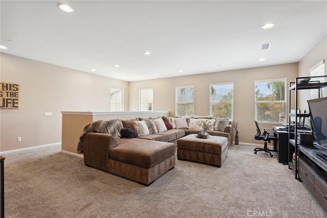 living room featuring light colored carpet, recessed lighting, and baseboards