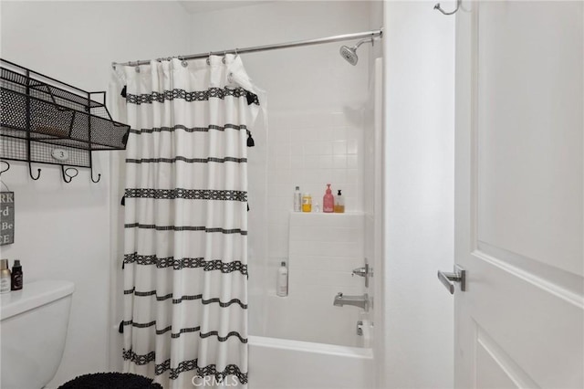 full bathroom with toilet and shower / bath combo with shower curtain