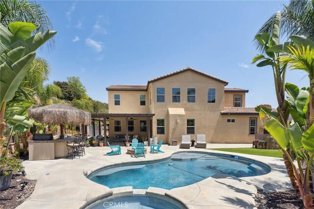 11266 Hutton Rd, Corona, CA 92883 - view of swimming pool with a pool with connected hot tub, a patio area, and a ceiling fan
