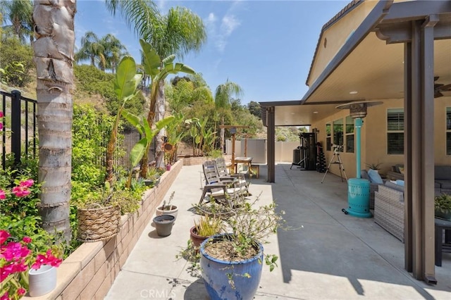view of patio featuring fence