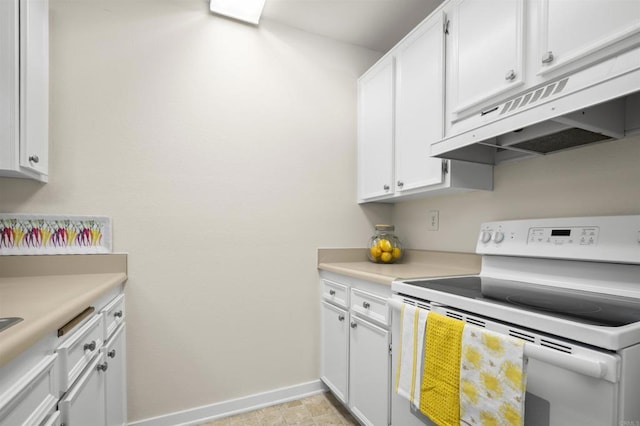 kitchen with light countertops, white range with electric cooktop, white cabinetry, baseboards, and under cabinet range hood