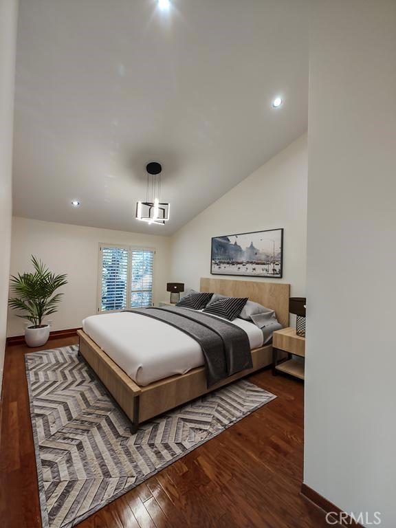 bedroom with baseboards, recessed lighting, and wood finished floors