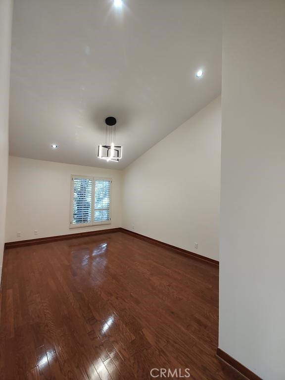 unfurnished room with baseboards, recessed lighting, and wood finished floors