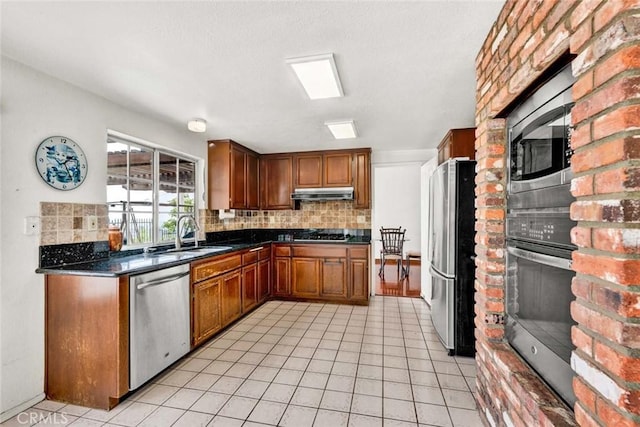6322 E E W View Dr, Orange, CA 92869 - kitchen with a sink, under cabinet range hood, tasteful backsplash, and stainless steel appliances