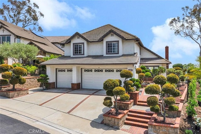 6322 E E W View Dr, Orange, CA 92869 - traditional home with stucco siding, driveway, and a garage