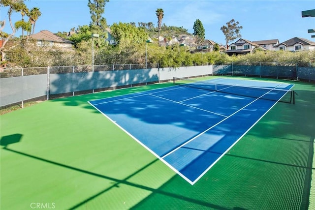6322 E E W View Dr, Orange, CA 92869 - view of tennis court with fence, community basketball court, and a residential view
