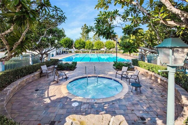 6322 E E W View Dr, Orange, CA 92869 - community pool with fence, a patio, and a community hot tub