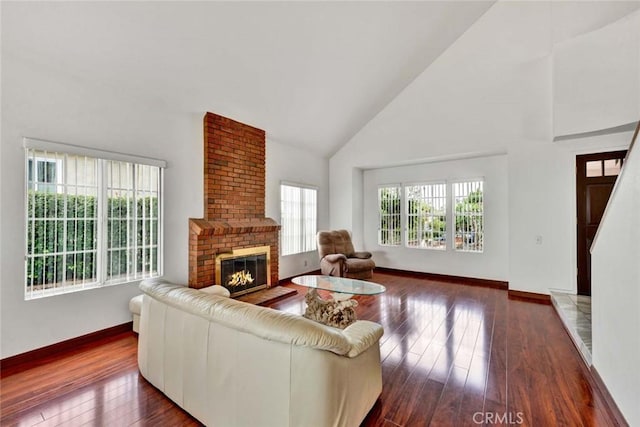 6322 E E W View Dr, Orange, CA 92869 - living area featuring baseboards, high vaulted ceiling, a wealth of natural light, and hardwood / wood-style floors