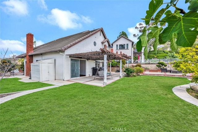 6322 E E W View Dr, Orange, CA 92869 - rear view of property featuring a patio, stucco siding, a pergola, a lawn, and fence