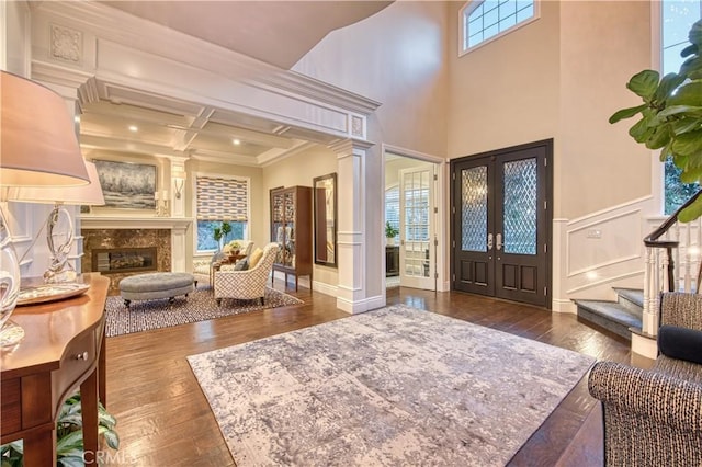 32 Panorama, Coto De Caza, CA 92679 - foyer featuring french doors, hardwood / wood-style floors, decorative columns, a high end fireplace, and ornamental molding