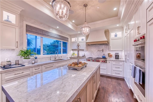 32 Panorama, Coto De Caza, CA 92679 - kitchen with a sink, an inviting chandelier, ornamental molding, and stainless steel double oven