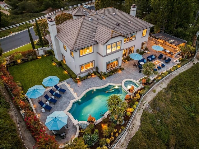 32 Panorama, Coto De Caza, CA 92679 - rear view of house with outdoor dining area, an in ground hot tub, stucco siding, and a chimney