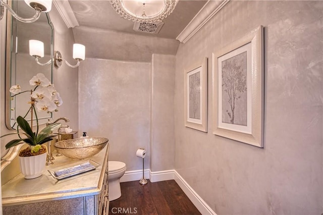 32 Panorama, Coto De Caza, CA 92679 - bathroom with crown molding, vanity, toilet, baseboards, and wood finished floors