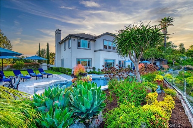 32 Panorama, Coto De Caza, CA 92679 - back of house featuring fence, a patio, a chimney, and stucco siding