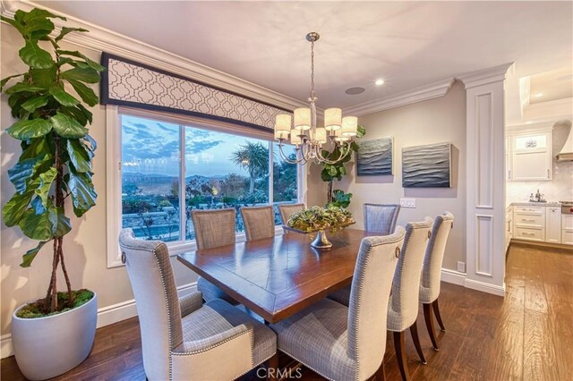 32 Panorama, Coto De Caza, CA 92679 - dining space with baseboards, ornamental molding, a notable chandelier, and dark wood-type flooring