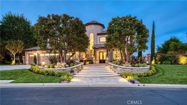 32 Panorama, Coto De Caza, CA 92679 - view of front of house featuring a front lawn, driveway, and stone siding