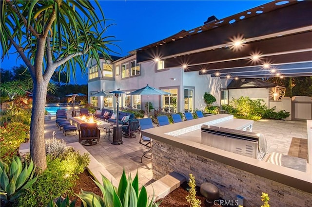 32 Panorama, Coto De Caza, CA 92679 - patio at night featuring a fire pit