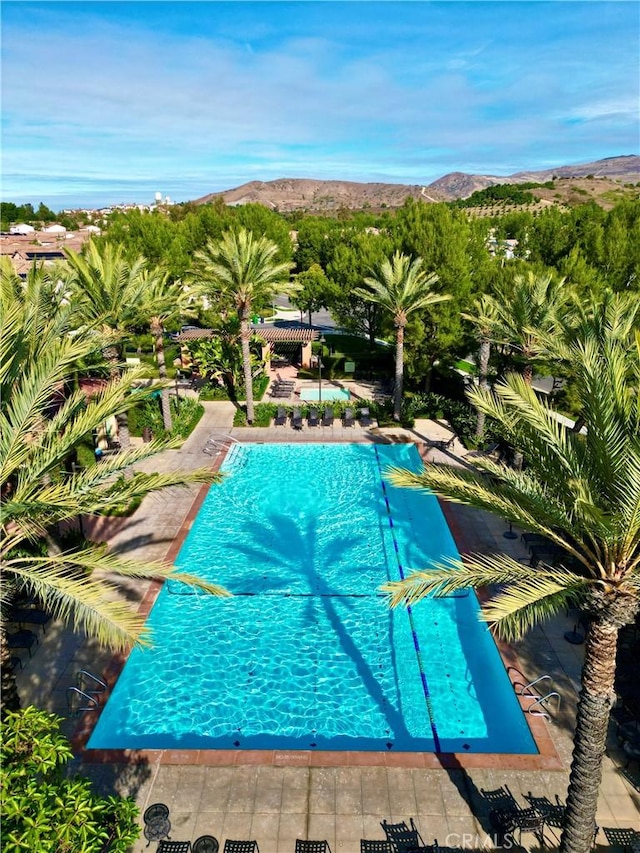 community pool featuring a mountain view