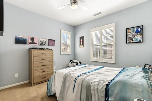 bedroom with light carpet, baseboards, and ceiling fan