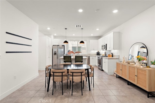 dining room featuring recessed lighting, baseboards, visible vents, and light tile patterned floors
