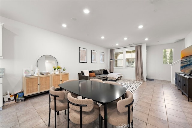 dining space with light tile patterned floors, baseboards, and recessed lighting