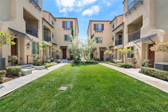 view of property's community with a lawn