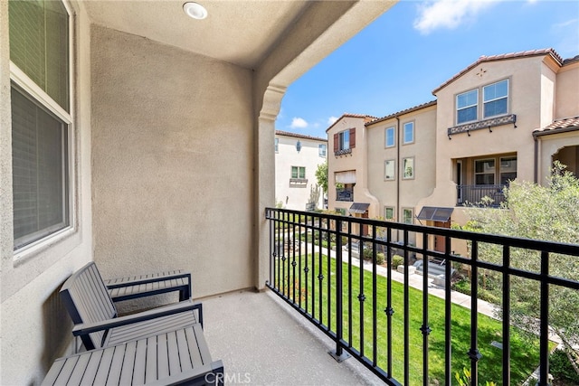 balcony featuring a residential view