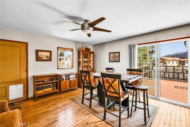 dining room with light wood-style flooring and ceiling fan