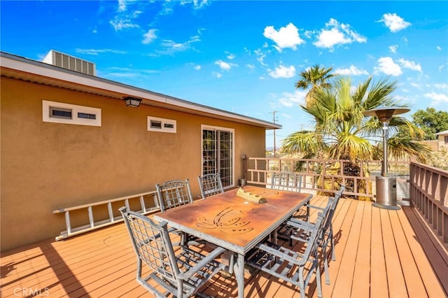 wooden terrace featuring outdoor dining area
