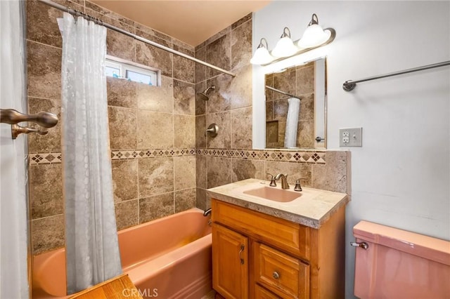 bathroom with vanity, decorative backsplash, toilet, and shower / tub combo with curtain