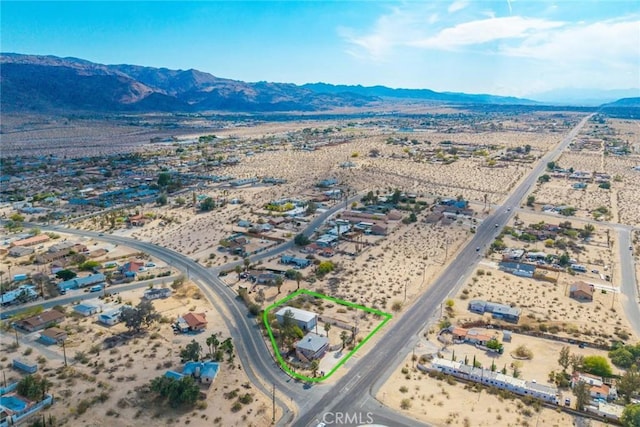 aerial view featuring a rural view, a mountain view, and view of desert