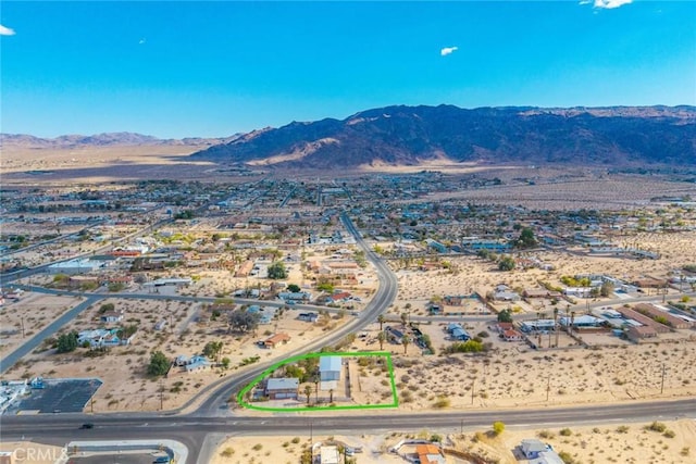drone / aerial view with a desert view and a mountain view