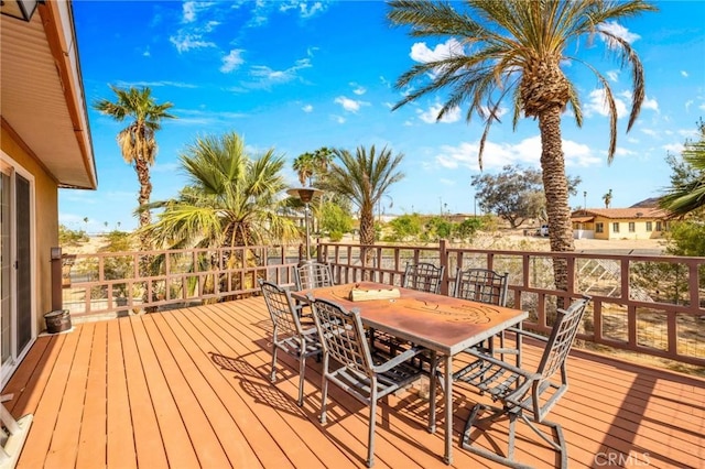 wooden deck with outdoor dining space